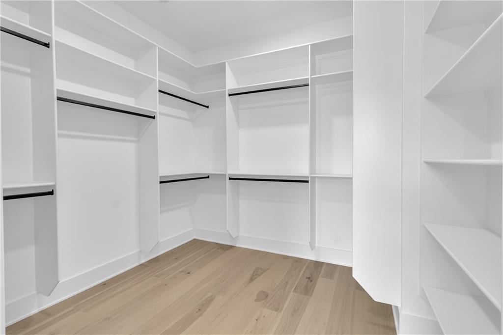 1939 Sunny Hill Road Lawrenceville, GA 30043 - Photo 36 of 47 a view of an empty room with wooden floor