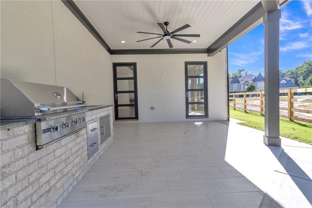 1939 Sunny Hill Road Lawrenceville, GA 30043 - Photo 42 of 47 a view of a hallway with furniture and windows