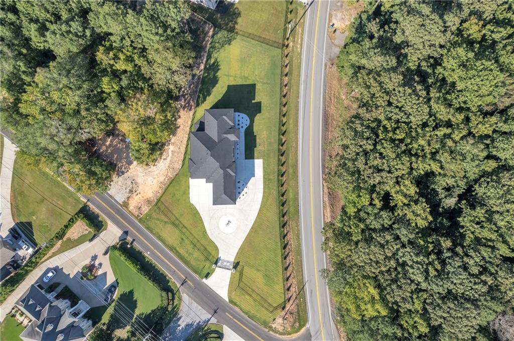 1939 Sunny Hill Road Lawrenceville, GA 30043 - Photo 44 of 47 an aerial view of a house with a garden