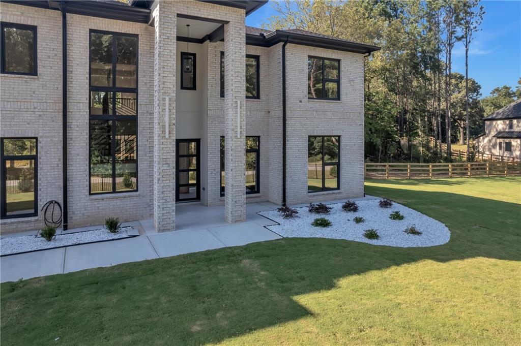 1939 Sunny Hill Road Lawrenceville, GA 30043 - Photo 5 of 47 a view of an house with backyard and outdoor space