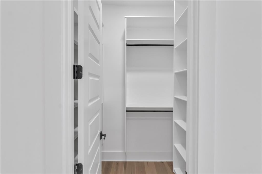1939 Sunny Hill Road Lawrenceville, GA 30043 - Photo 10 of 47 a view of walk in closet with empty racks