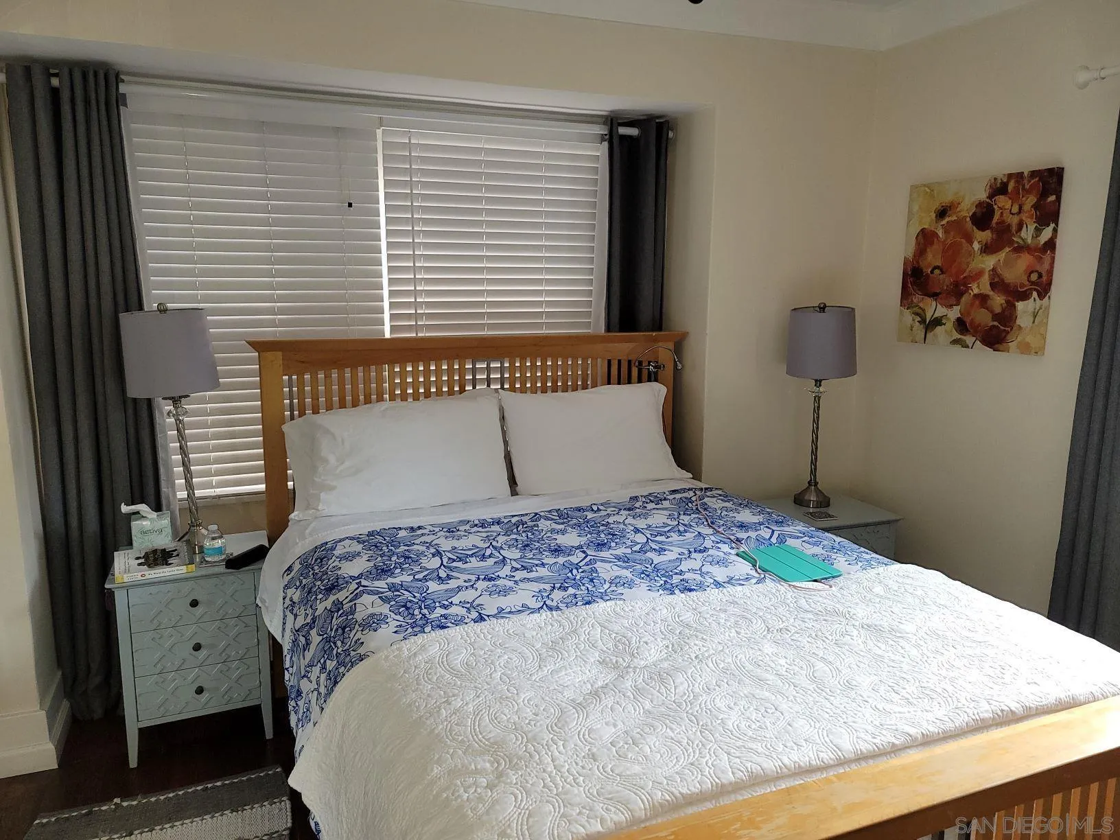 3967-69 8th Avenue San Diego, CA 92103 - Photo 2 of 10 a bedroom with a large bed and a dresser