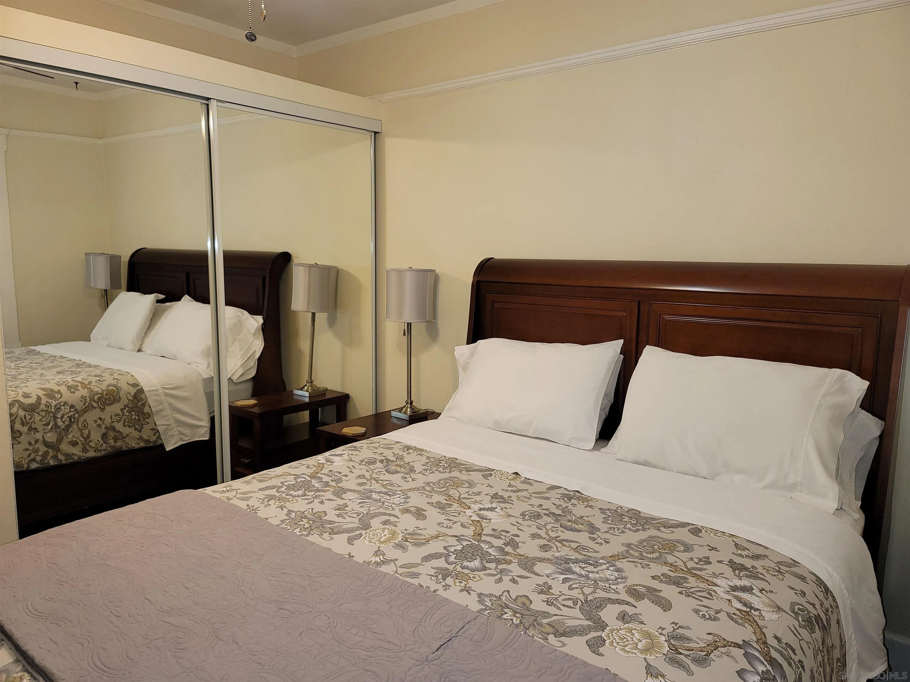 3967-69 8th Avenue San Diego, CA 92103 - Photo 4 of 10 a bedroom with a bed and a night stand