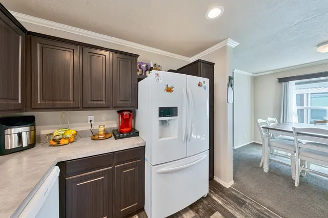 a white refrigerator freezer sitting in a kitchen