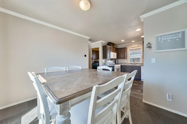 a kitchen with a table and chairs in it