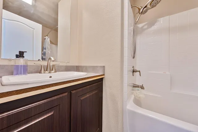 a bathroom with a sink and a bathtub