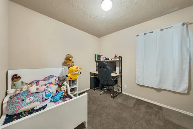 an empty room with a dresser