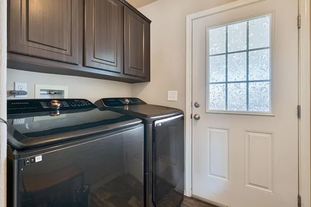 a view of a backyard with large trees