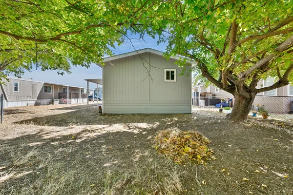 a view of a house with a tree