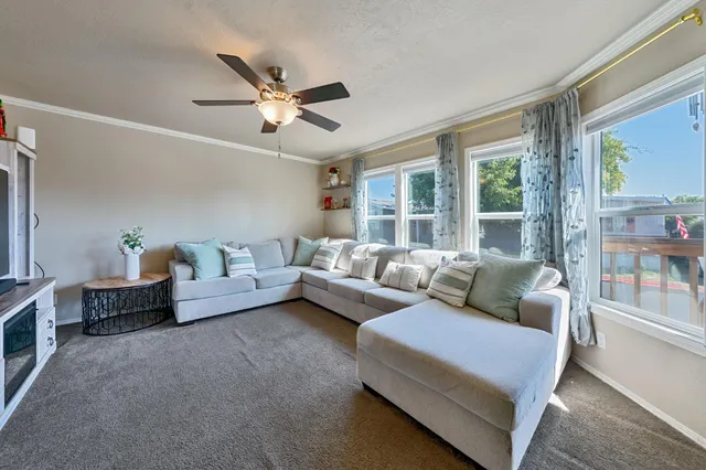 a living room with furniture and a window