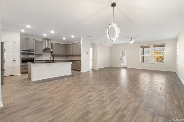 a view of a kitchen with stove and cabinets