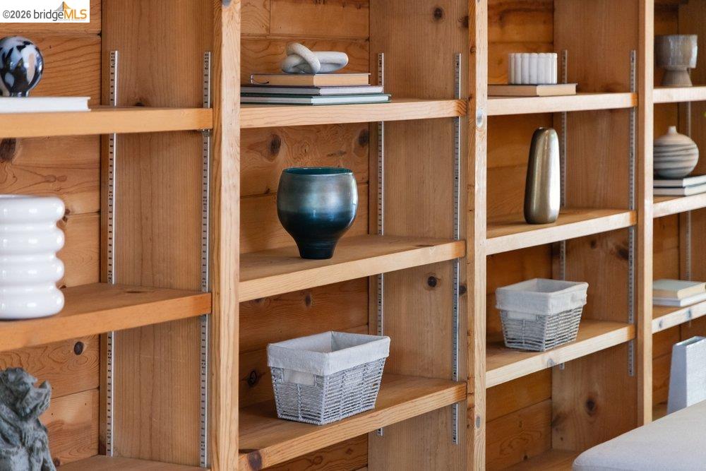 287 Purdue Avenue Kensington, CA 94708 - Photo 20 of 60 Integrated wooden shelving system featuring adjustable shelves and natural wood-finish paneling