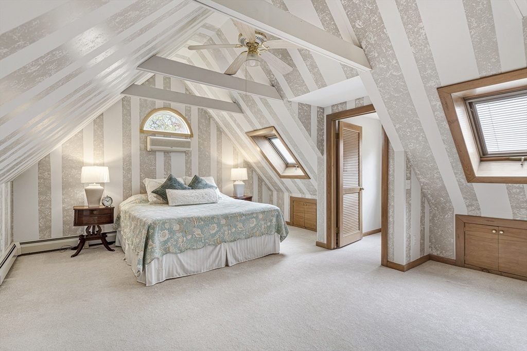 94 Howland Road Westport, MA 02790 - Photo 28 of 33 a spacious bedroom with a bed and a mirror