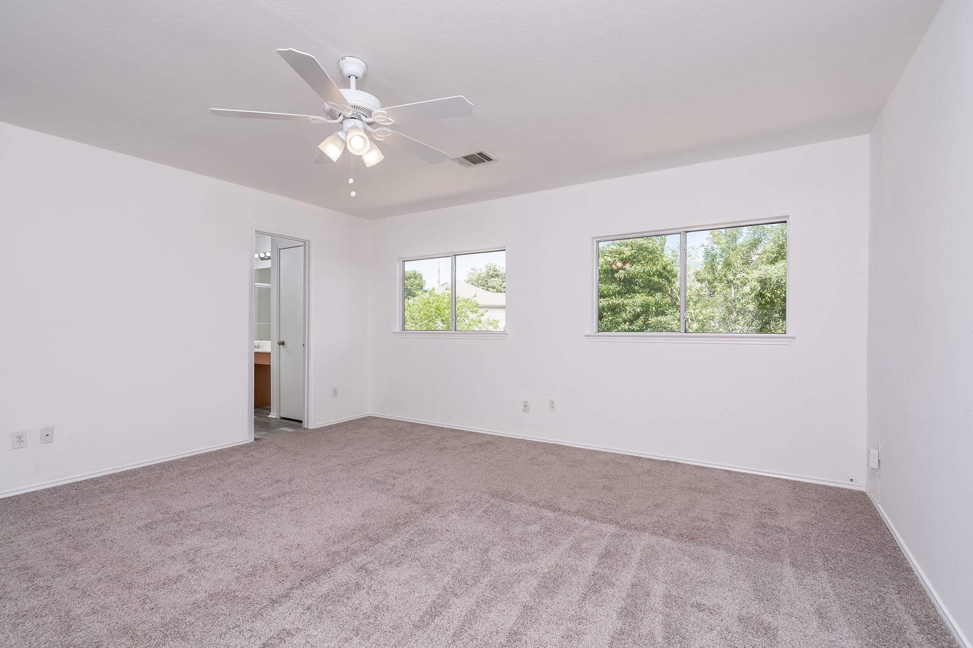 1305 Water Spaniel Way Round Rock, TX 78664 - Photo 17 of 27 a view of an empty room with a window
