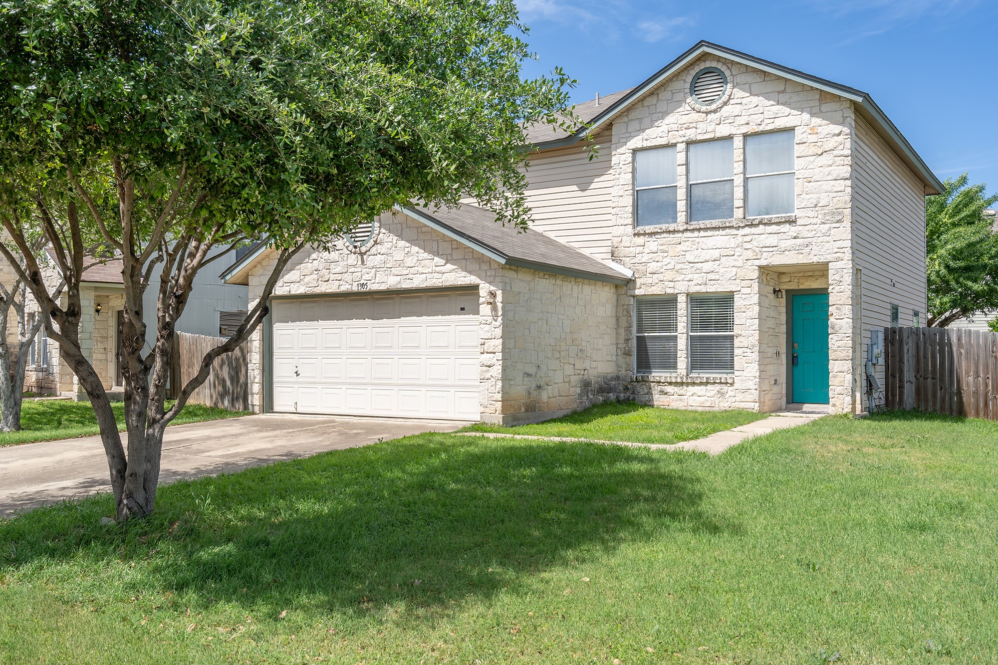 1305 Water Spaniel Way Round Rock, TX 78664 - Photo 3 of 27 a front view of a house with a yard and garage