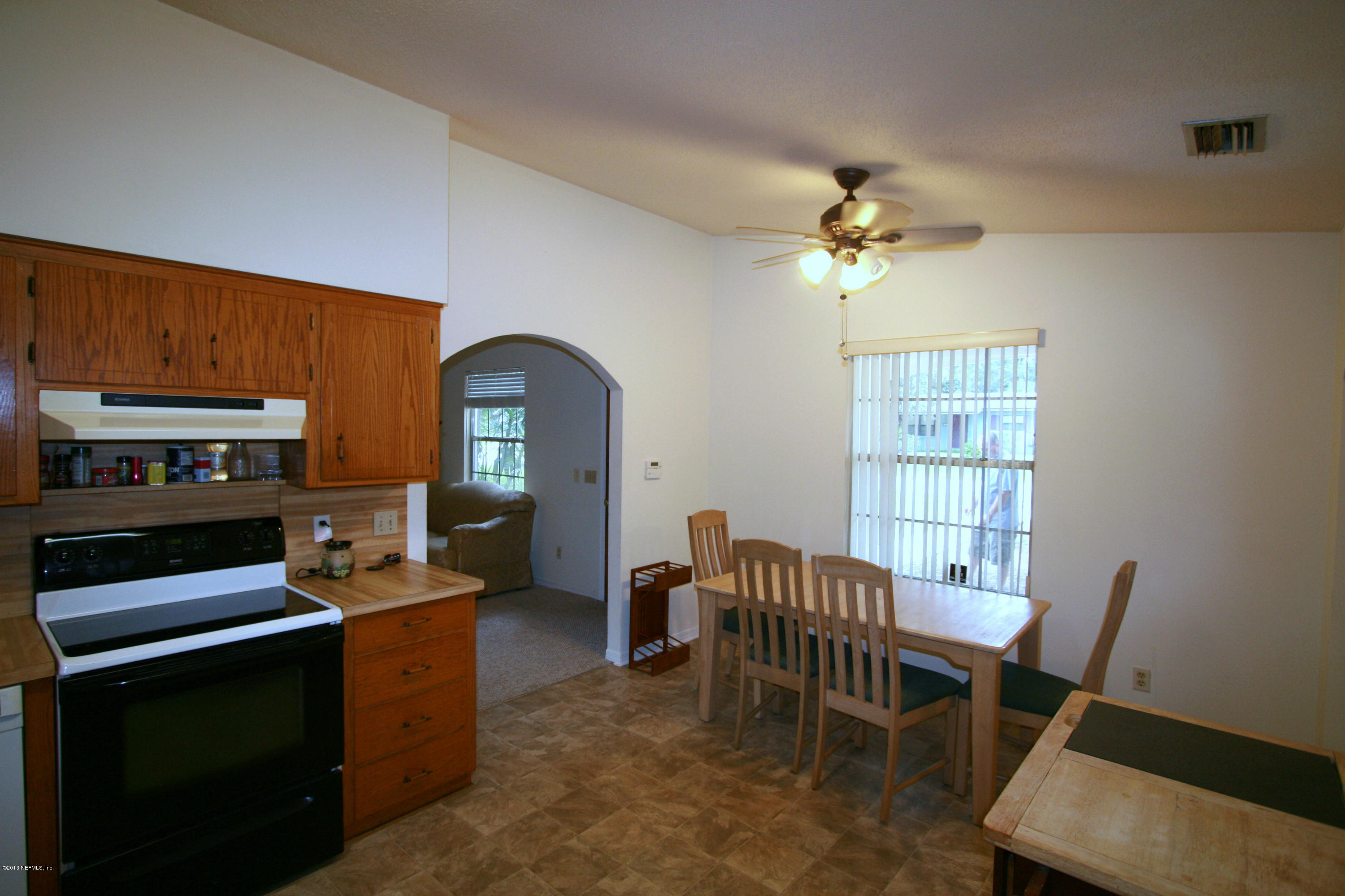 523 Gentian Road St. Augustine, FL 32086 - Photo 11 of 26 a view of a workspace with furniture and a window