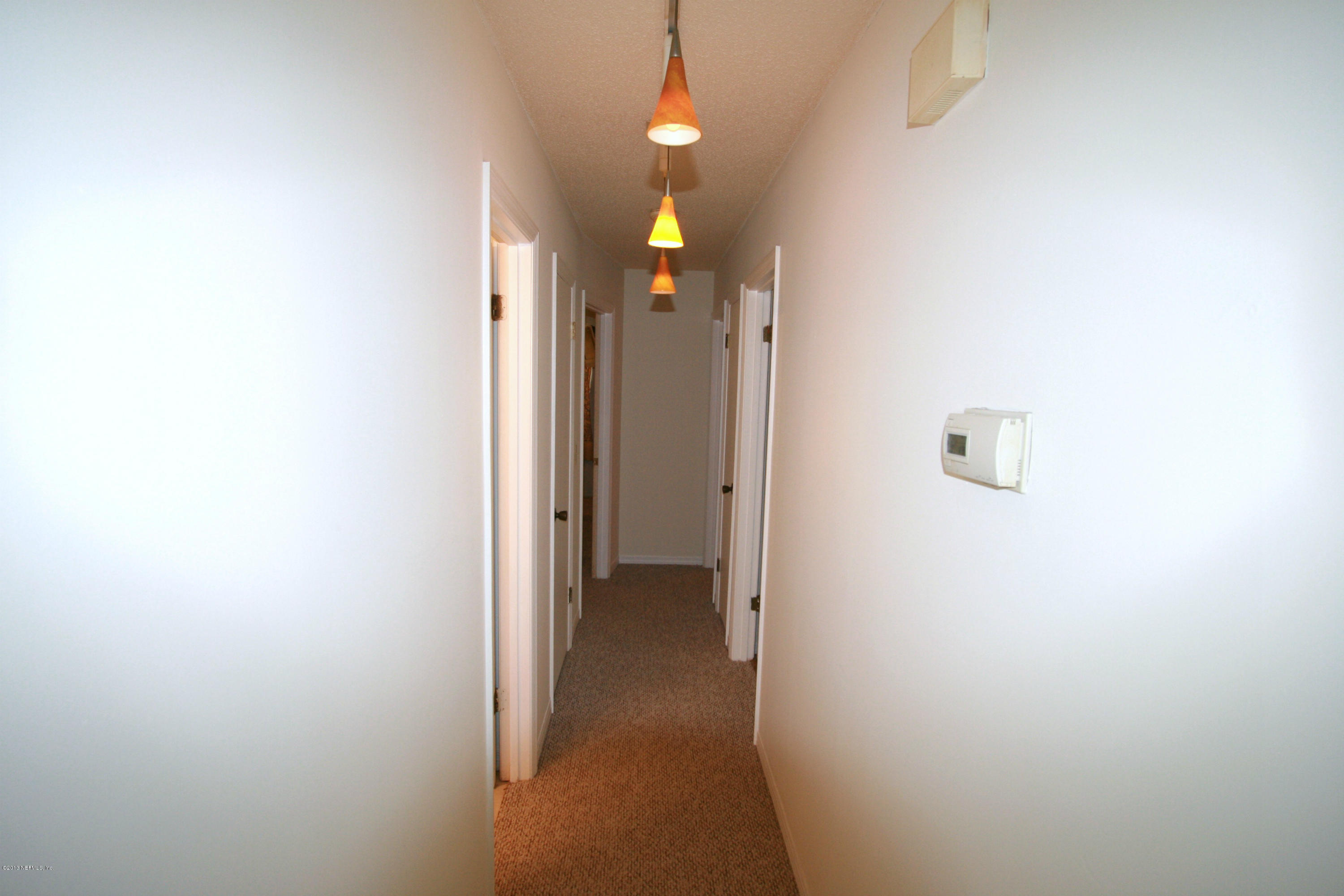 523 Gentian Road St. Augustine, FL 32086 - Photo 13 of 26 a view of a hallway with wooden floor