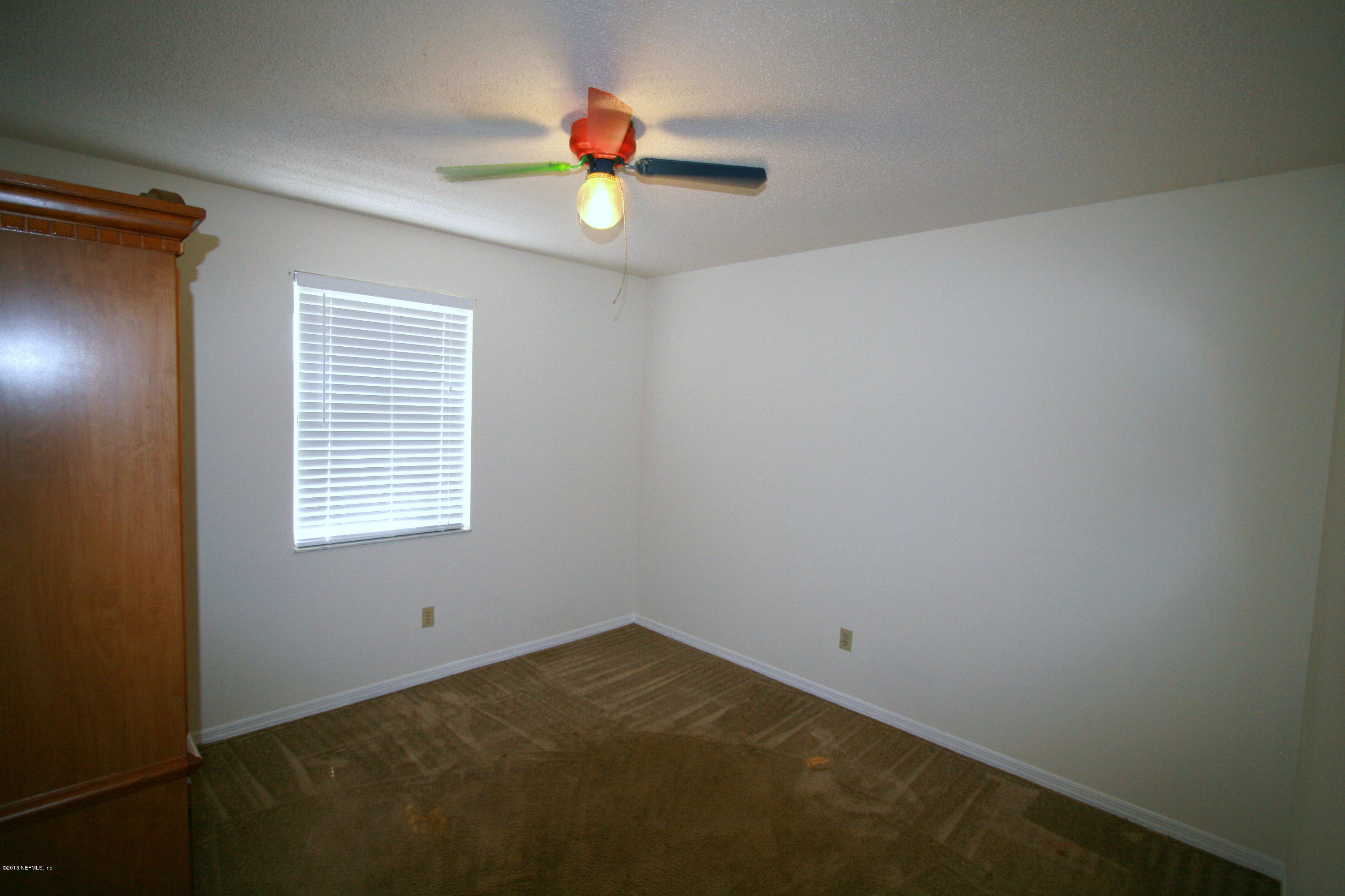 523 Gentian Road St. Augustine, FL 32086 - Photo 15 of 26 a view of an empty room with a window