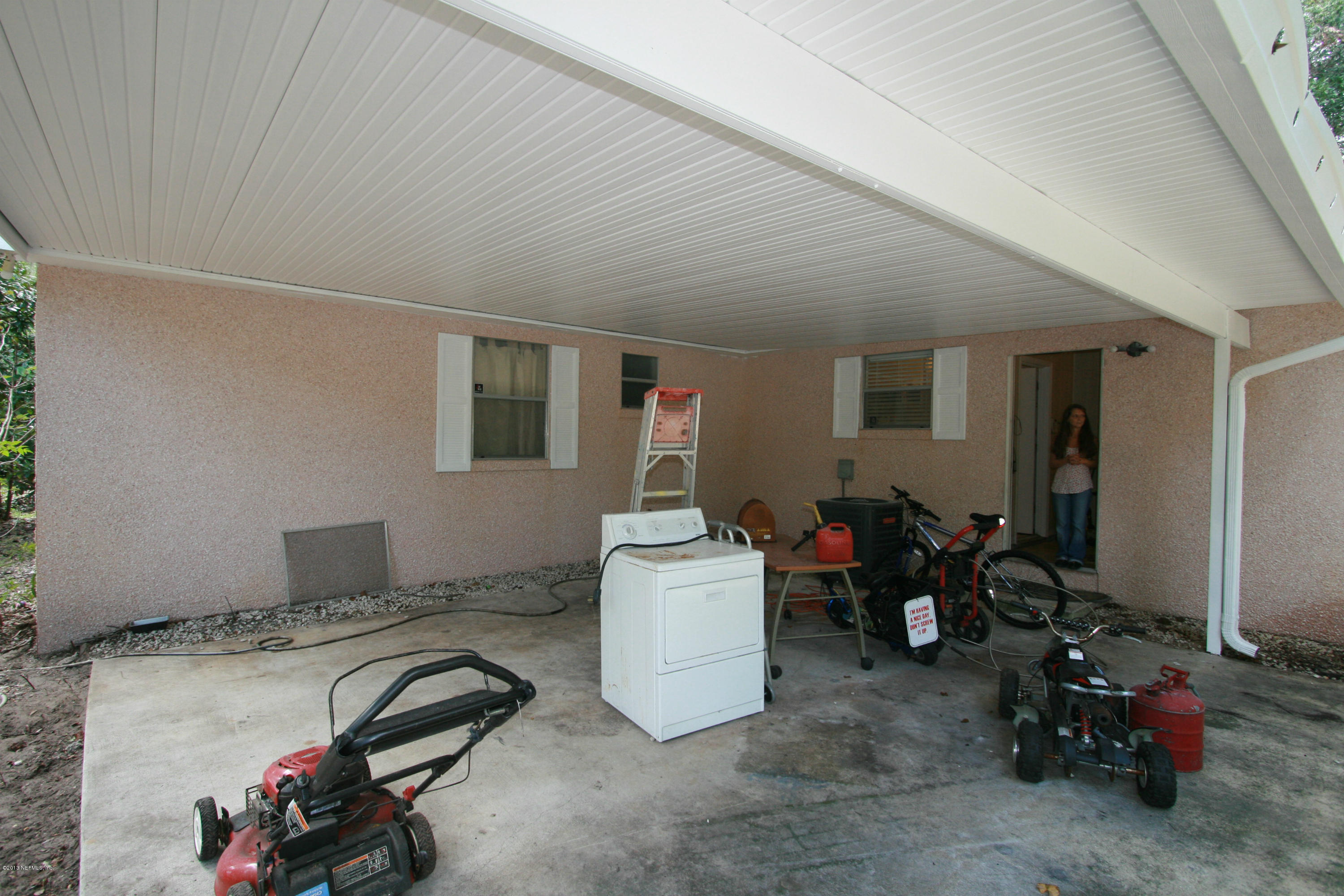 523 Gentian Road St. Augustine, FL 32086 - Photo 21 of 26 a room with gym equipment and a window