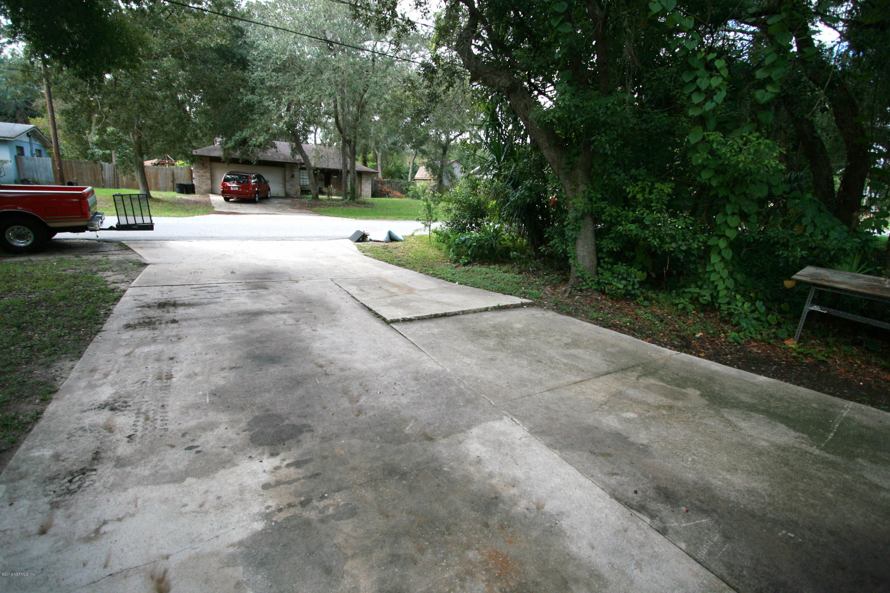 523 Gentian Road St. Augustine, FL 32086 - Photo 23 of 26 a view of a street with a car parked in the background