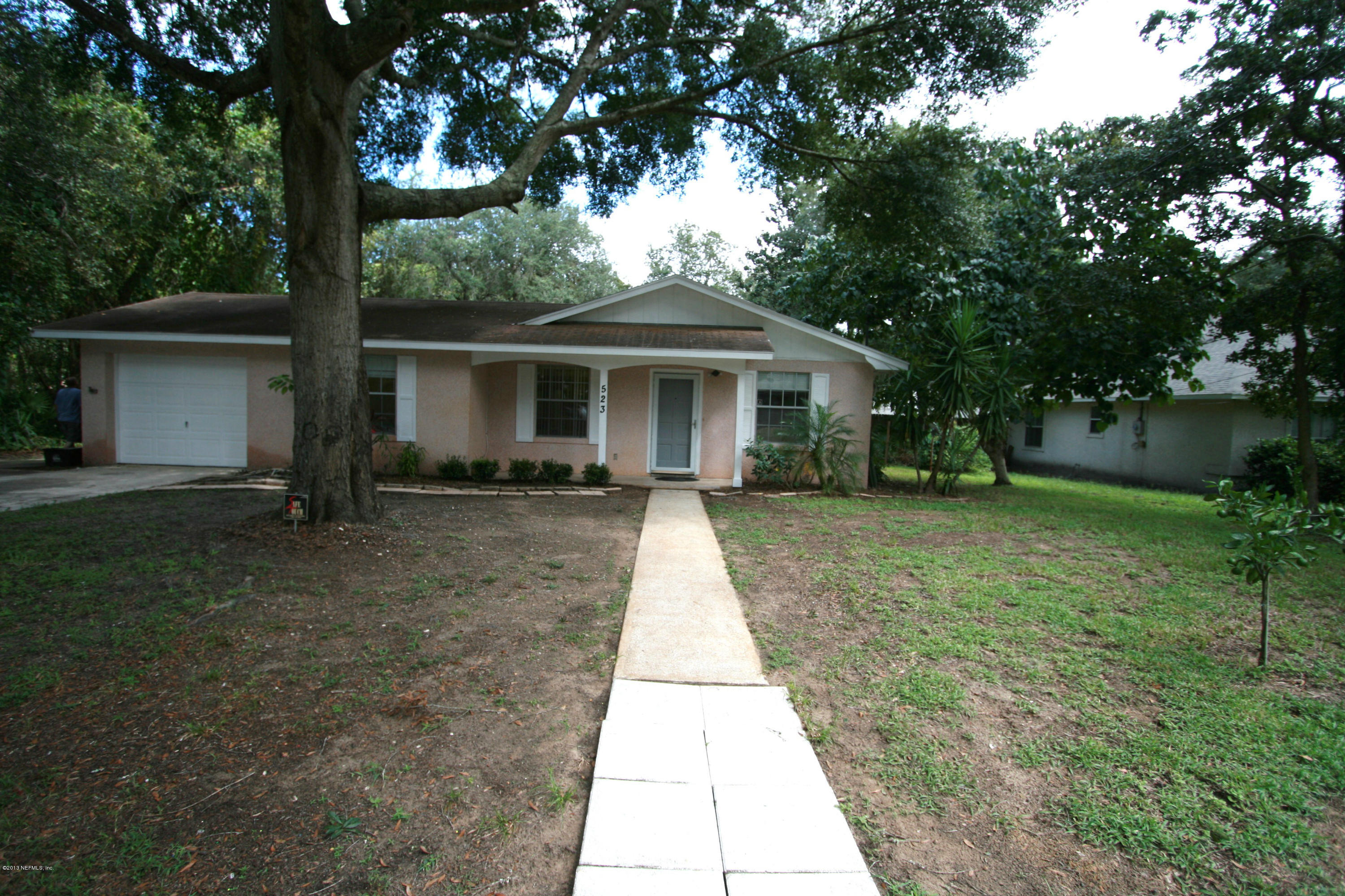 523 Gentian Road St. Augustine, FL 32086 - Photo 24 of 26 a front view of house with yard and green space