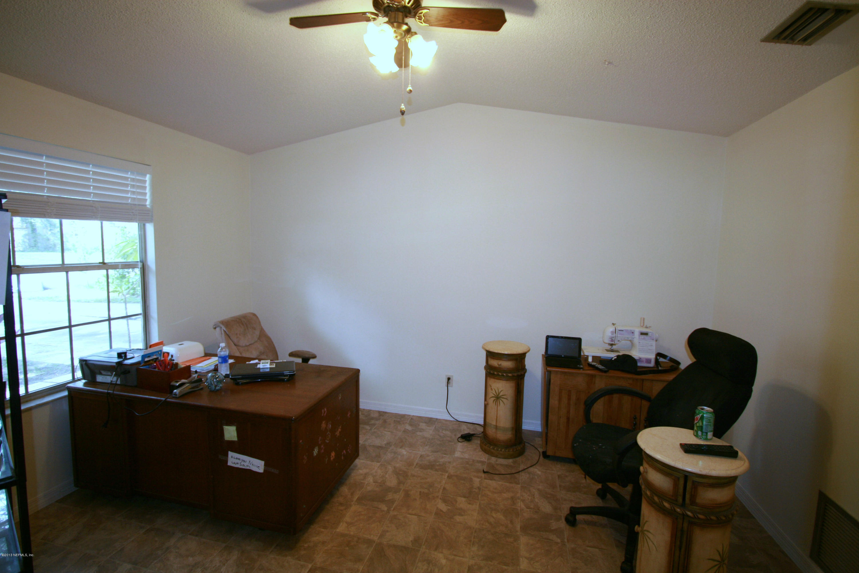 523 Gentian Road St. Augustine, FL 32086 - Photo 4 of 26 a room with furniture and window