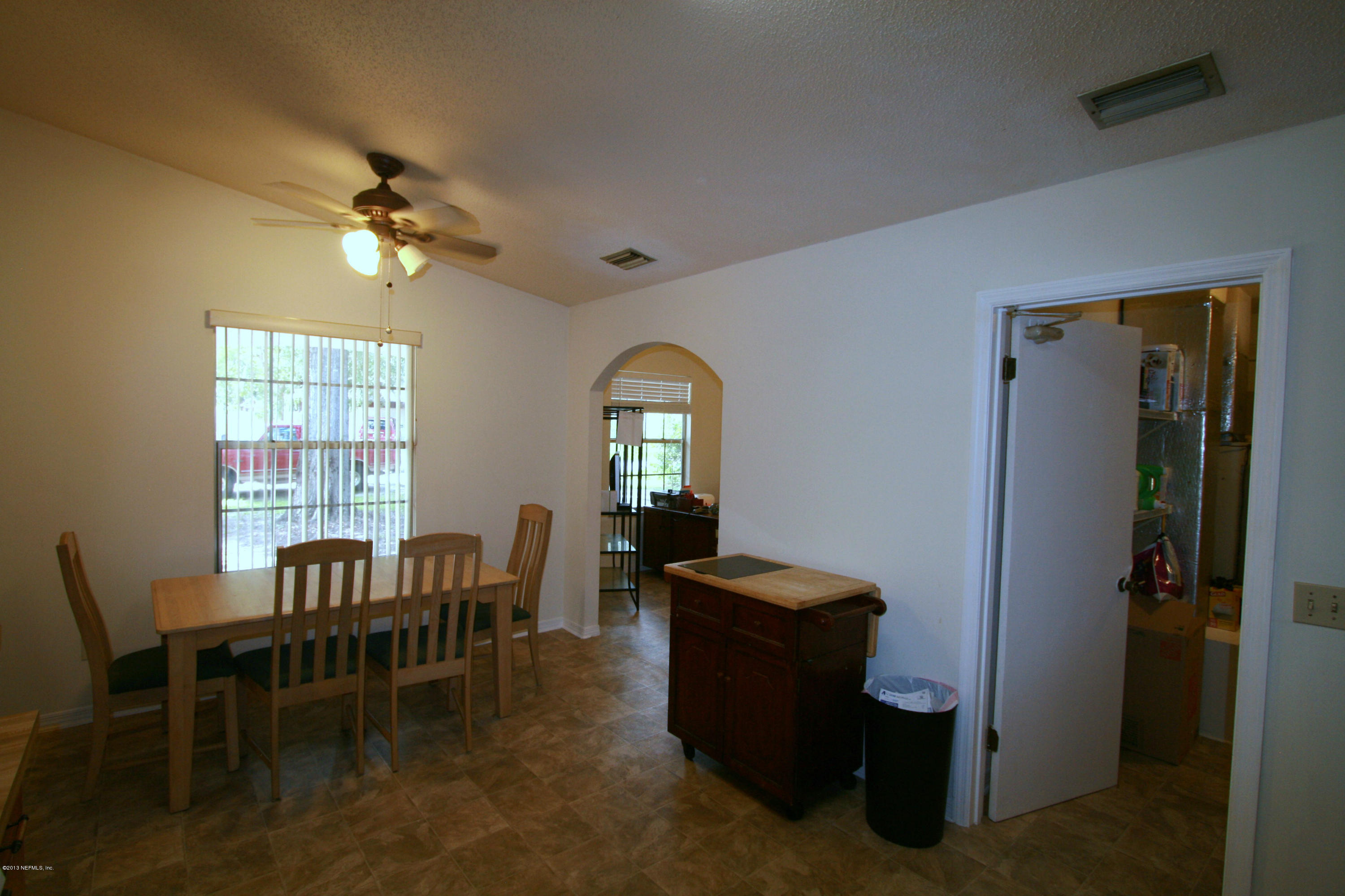 523 Gentian Road St. Augustine, FL 32086 - Photo 7 of 26 a view of a livingroom with furniture and windows