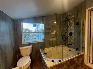 a view of a kitchen with a sink and dishwasher a refrigerator freezer