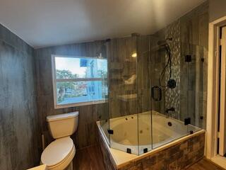 913 Lobster Lane Key Largo, FL 33037 - Photo 15 of 20 a bathroom with a tub a toilet and a shower