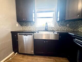 913 Lobster Lane Key Largo, FL 33037 - Photo 18 of 20 a kitchen with granite countertop a sink and a stove