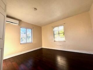 913 Lobster Lane Key Largo, FL 33037 - Photo 3 of 20 a view of an empty room with wooden floor and a window