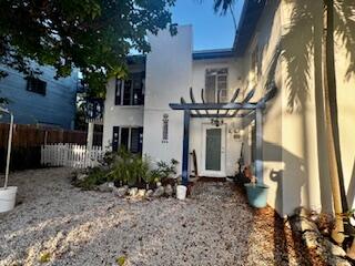 913 Lobster Lane Key Largo, FL 33037 - Photo 10 of 20 a front view of a house with garden