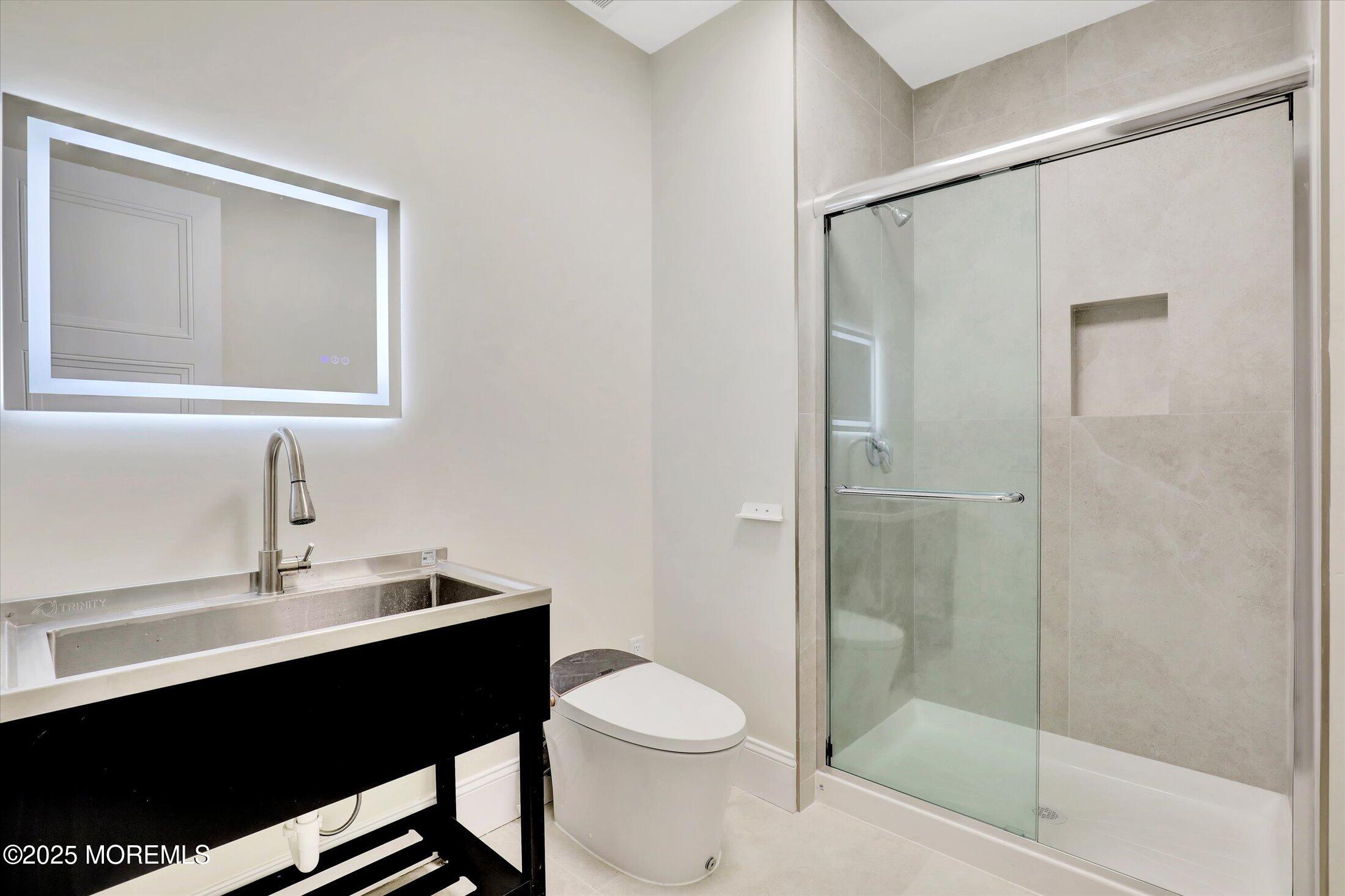 12 Cook Court Millstone Township, NJ 08535 - Photo 24 of 54 a bathroom with a sink vanity toilet and shower
