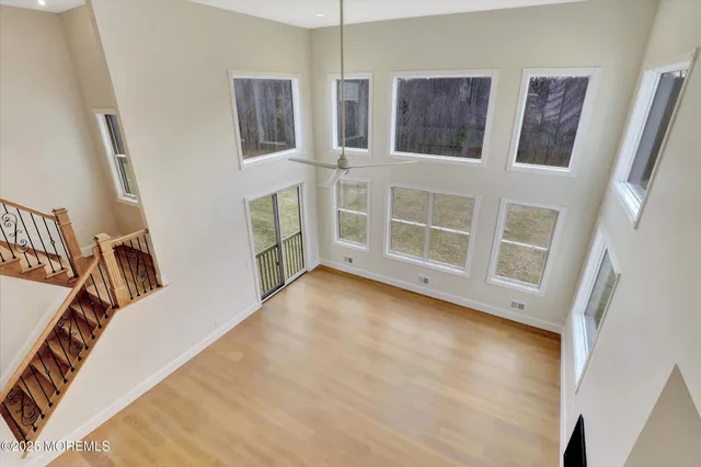 a spacious bathroom with a tub sink and mirror