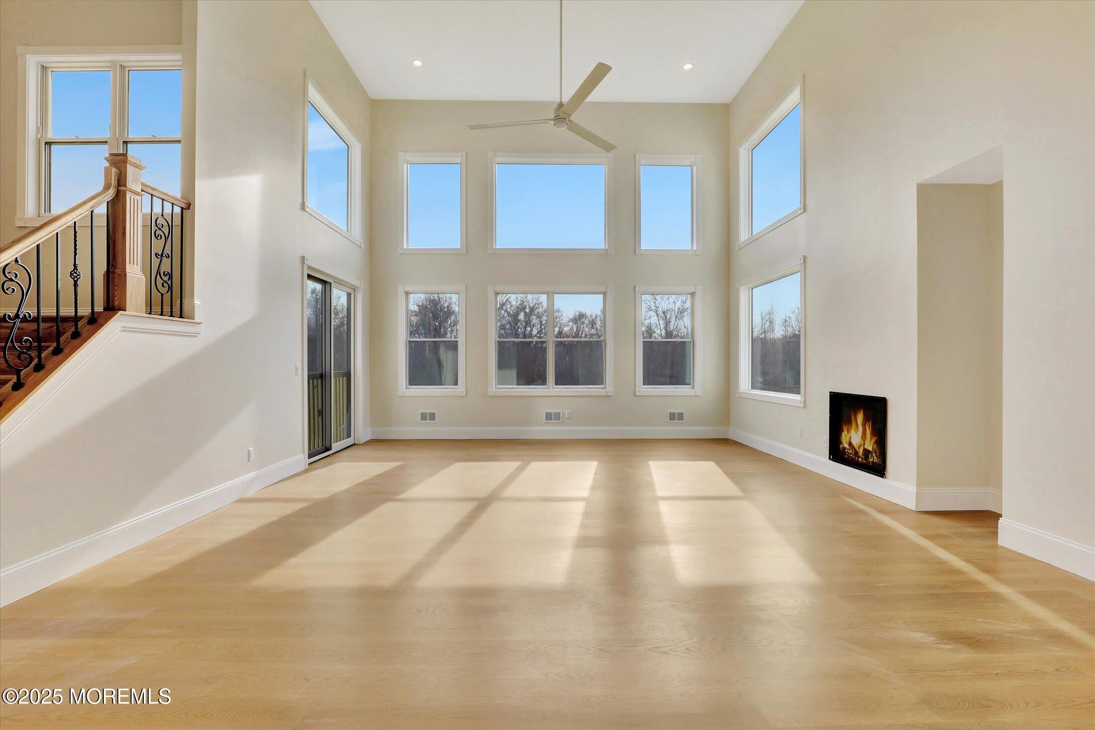 12 Cook Court Millstone Township, NJ 08535 - Photo 3 of 54 a view of an empty room with a fireplace and a window