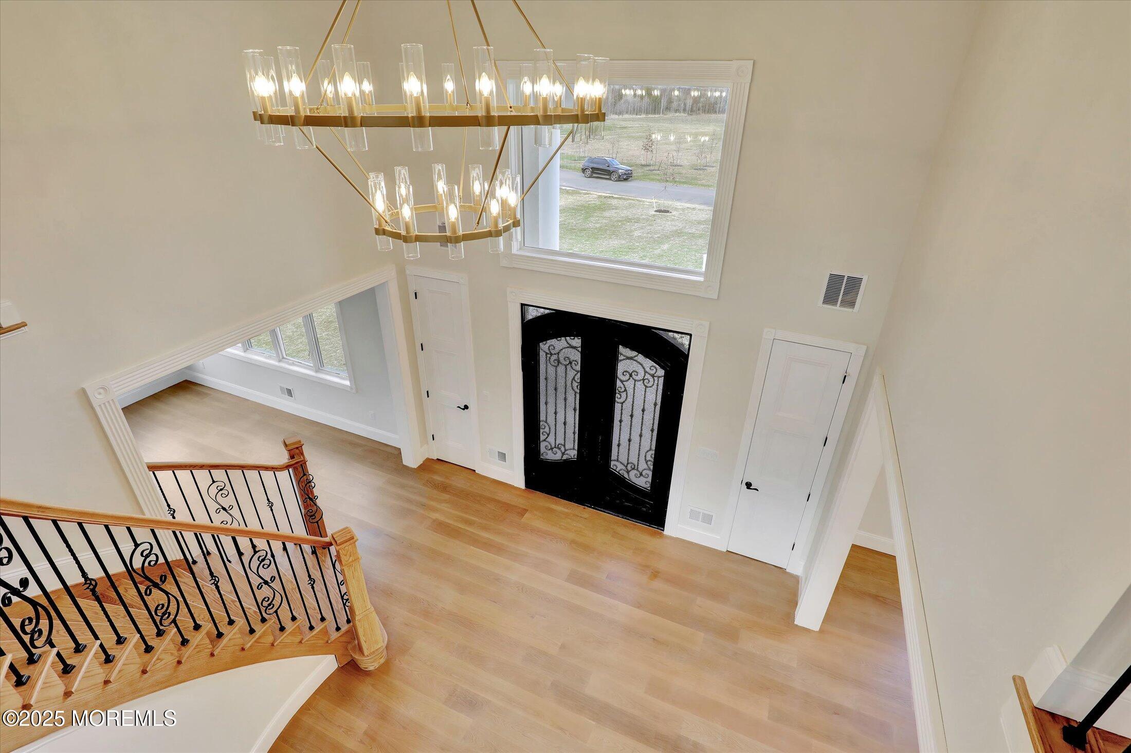 12 Cook Court Millstone Township, NJ 08535 - Photo 35 of 54 a view of entryway and chandelier