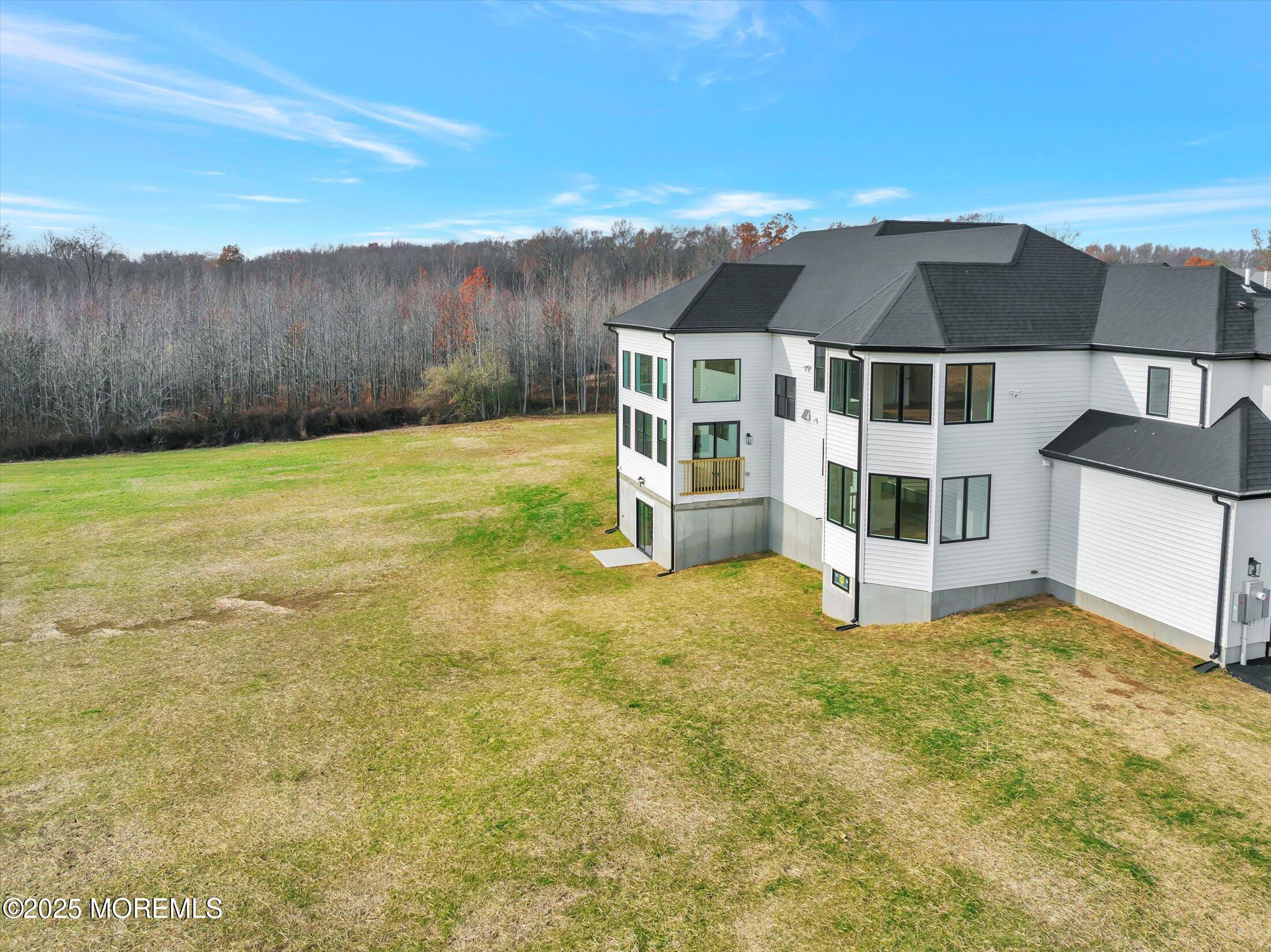 12 Cook Court Millstone Township, NJ 08535 - Photo 45 of 54 a view of a house with a yard and sitting area