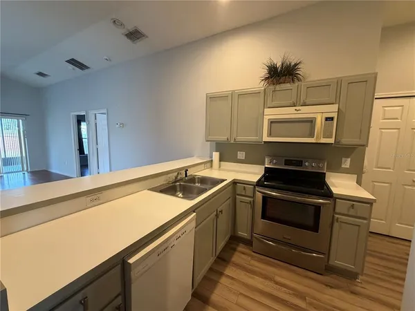a kitchen with a stove and a sink