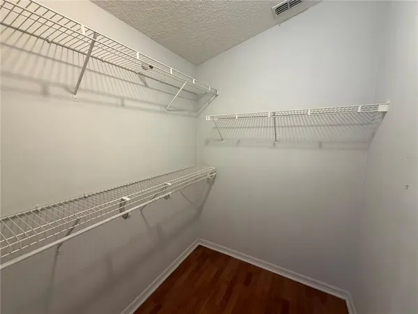 a view of a room with racks on the wall