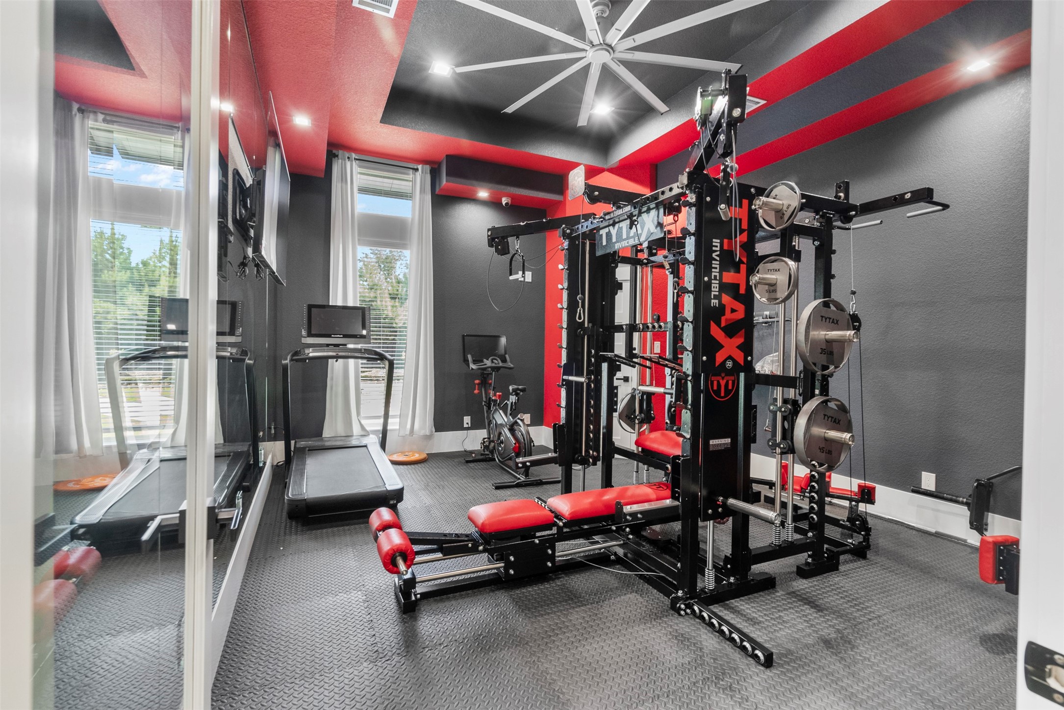 12 County Road 3558 Cleveland, TX 77327 - Photo 11 of 50 Exercise room fully equipped or can be utilized as an office or second dining area or even an extra bedroom.