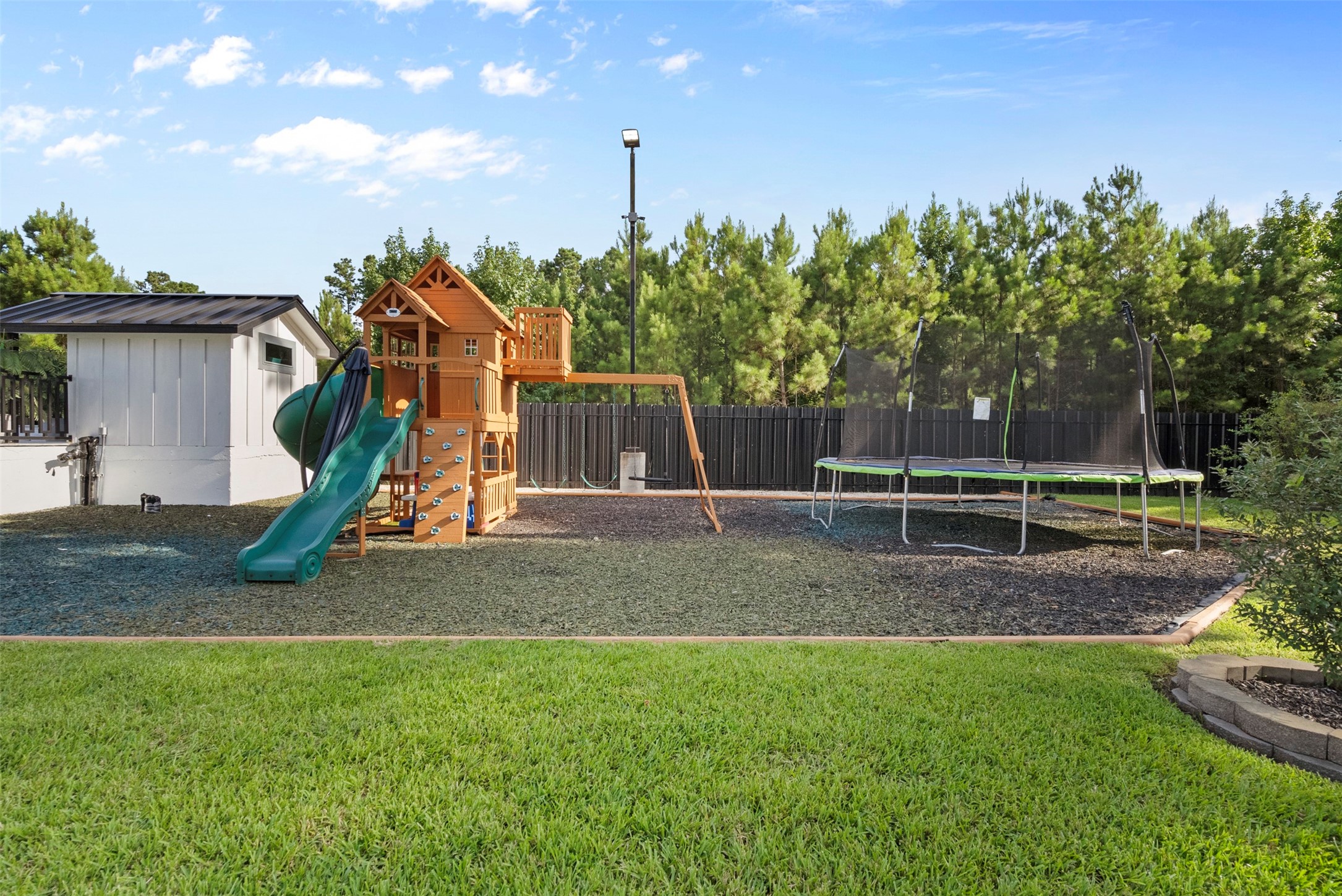 12 County Road 3558 Cleveland, TX 77327 - Photo 43 of 50 Park area with a fun playground. Trampoline was removed.