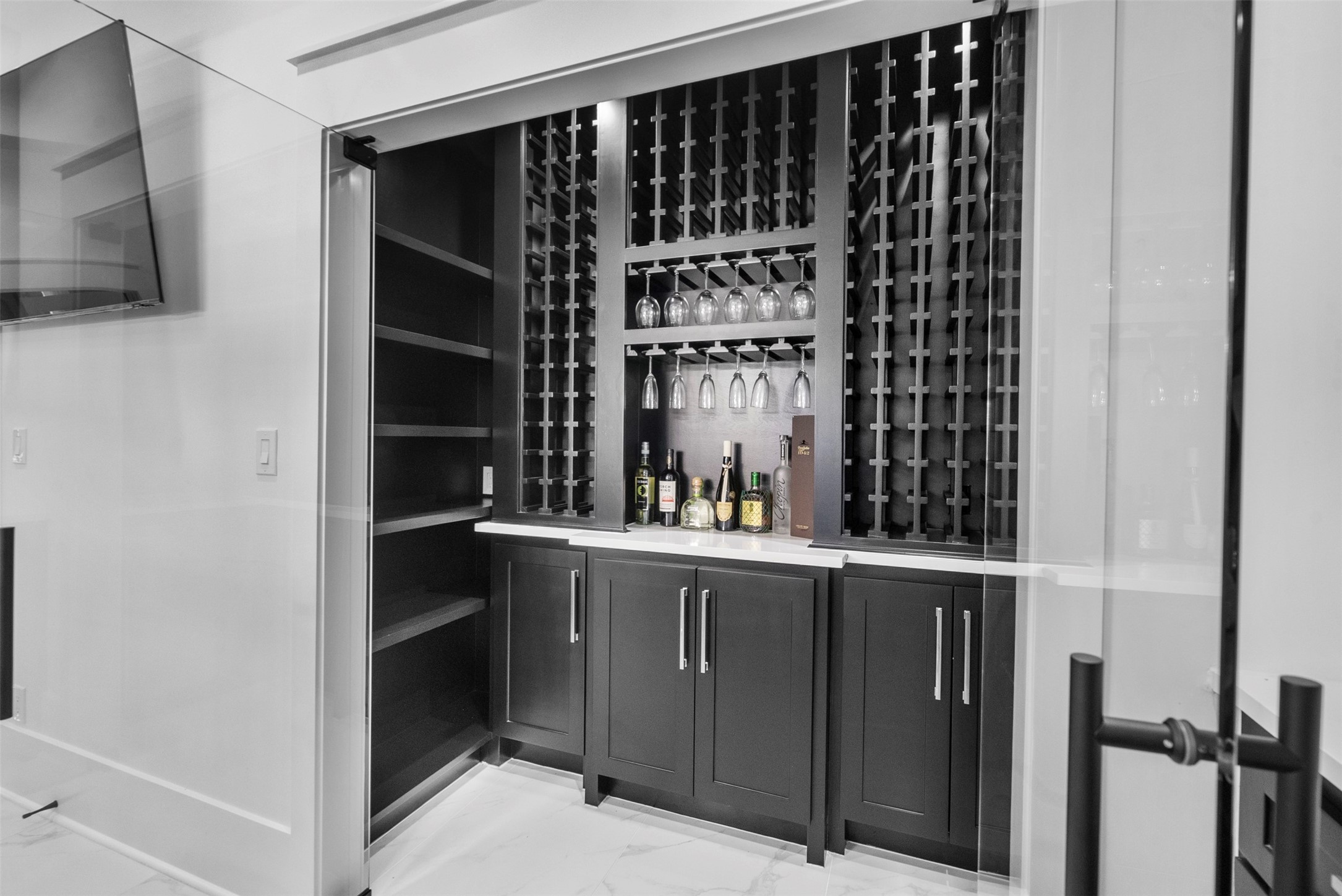 12 County Road 3558 Cleveland, TX 77327 - Photo 10 of 50 Custom, luxurious wine room featuring ample storage with elegant racks and cabinetry for your collection.