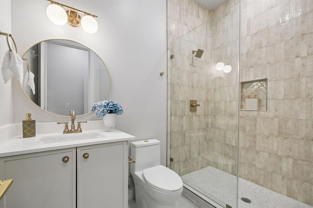 4615 Rusk Avenue Dallas, TX 75204 - Photo 23 of 25 a bathroom with a sink a toilet and shower