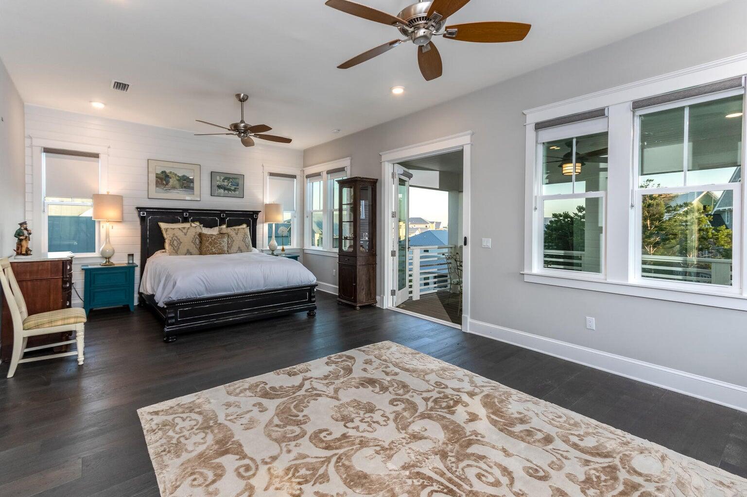 4 Clipper Street, Unit 1 Inlet Beach, FL 32461 - Photo 16 of 32 a bedroom with a bed ceiling fan and a window