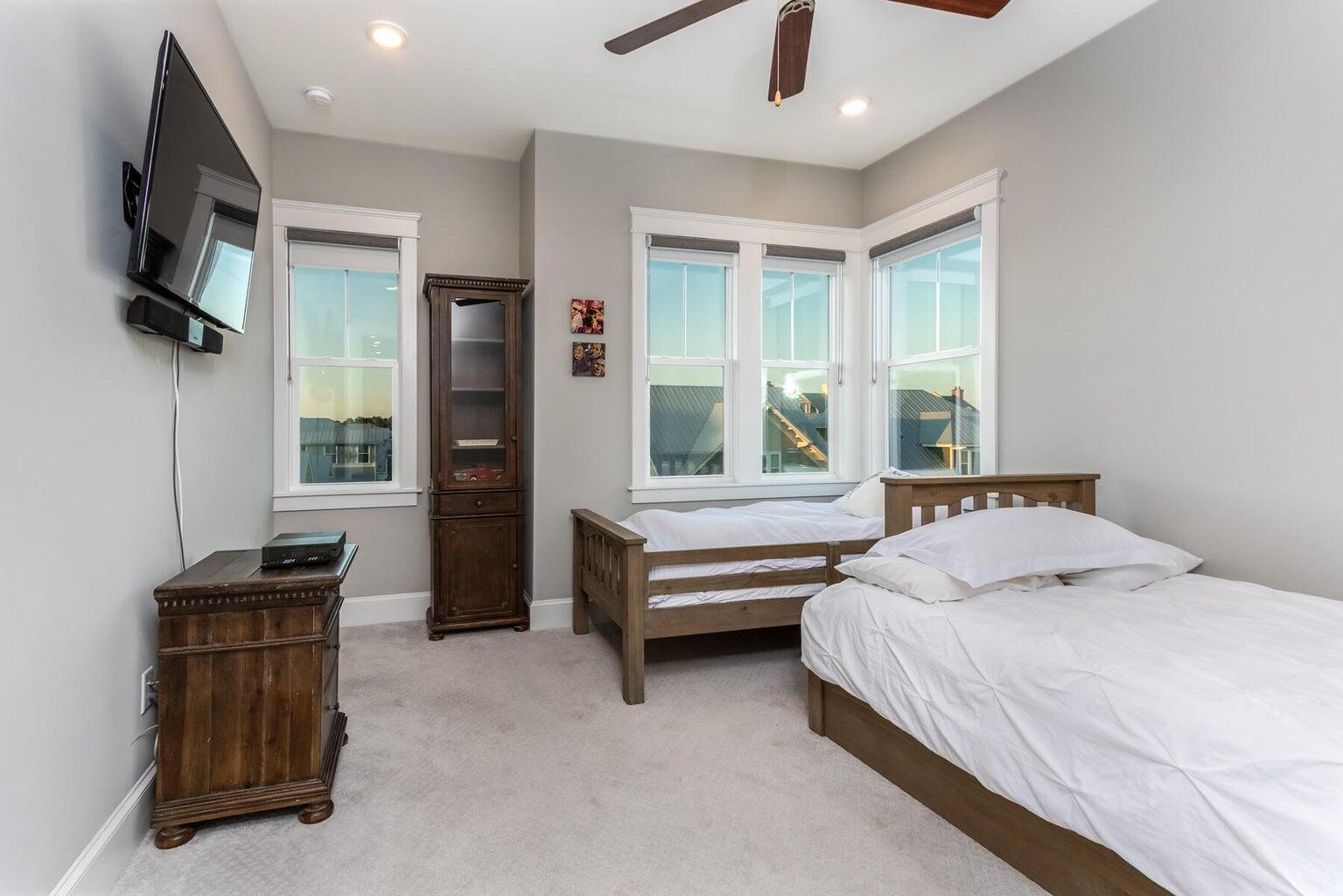 4 Clipper Street, Unit 1 Inlet Beach, FL 32461 - Photo 19 of 32 a bedroom with a bed and a television