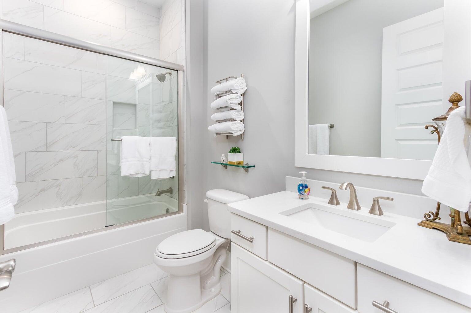 4 Clipper Street, Unit 1 Inlet Beach, FL 32461 - Photo 21 of 32 a bathroom with a sink a toilet and a mirror