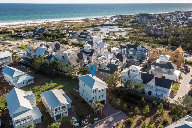 an aerial view of residential houses with outdoor space