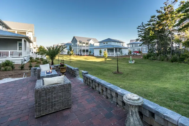 a view of an house with garden space and street view