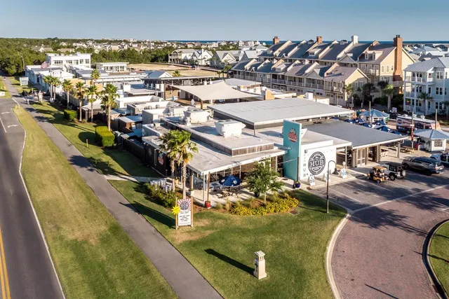 a view of a swimming pool with outdoor seating