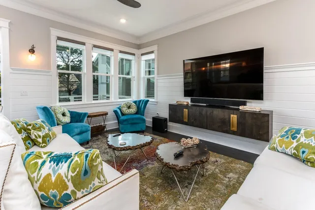 a living room with furniture and a flat screen tv